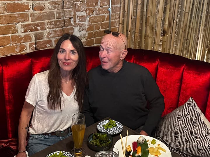 David Granger, Amy Cosper, a pile of raw fish and some edamame. The red velvet couch makes us look glamorous.